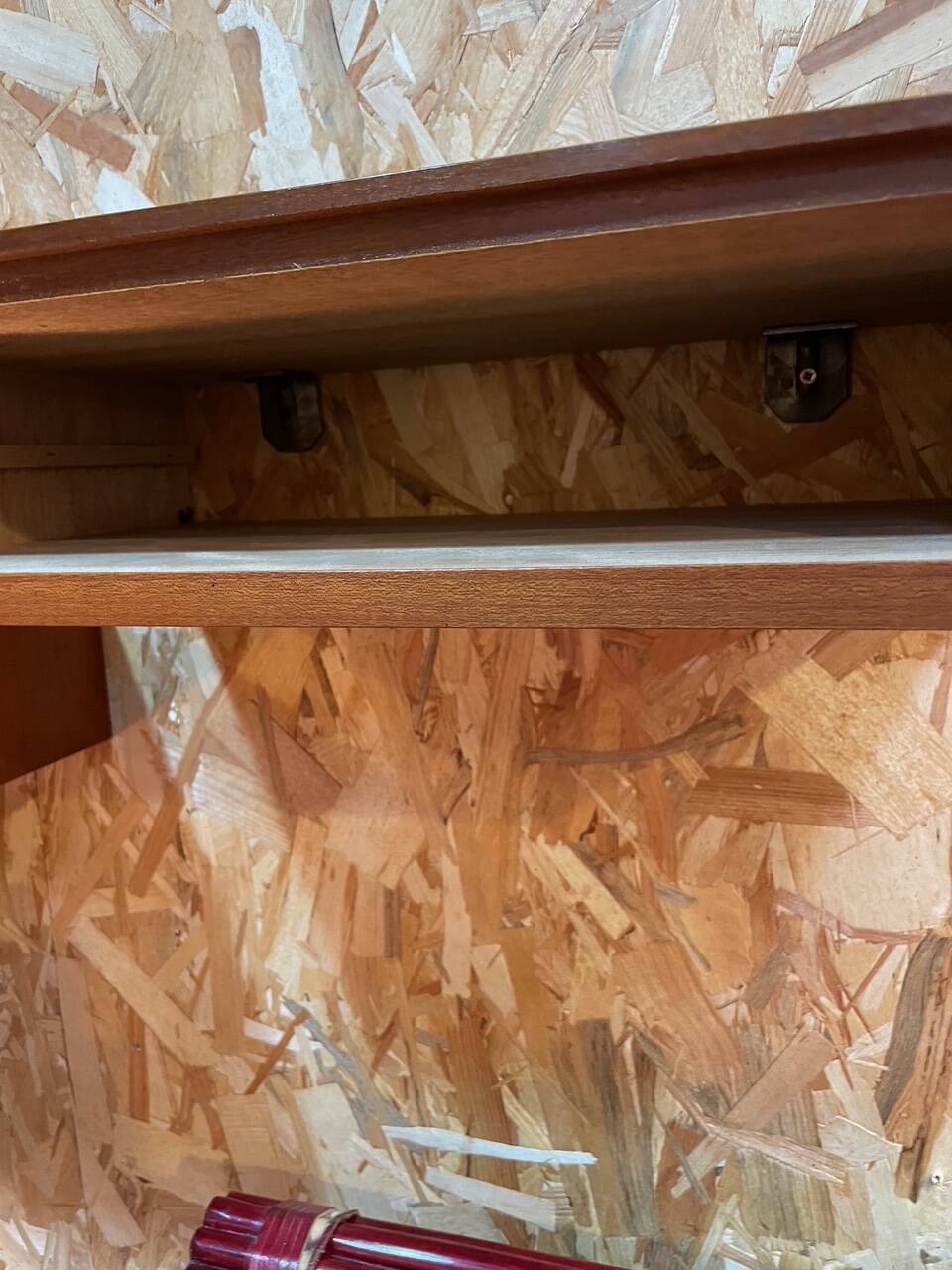 Suspended teak bedside tables in vintage 1960s Scandinavian style.