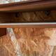 Suspended teak bedside tables in vintage 1960s Scandinavian style.