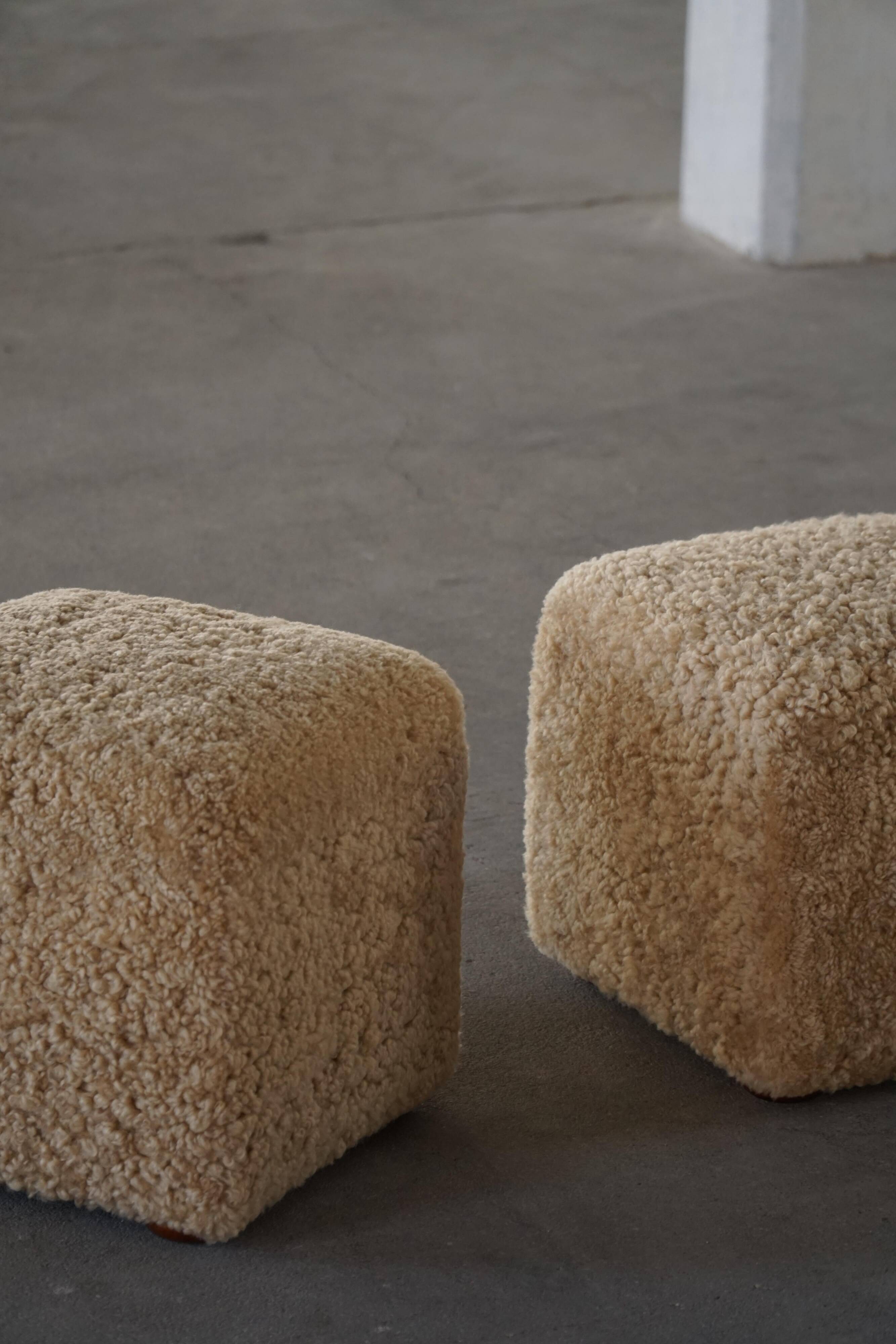 French mid-century cube poufs, a pair of lambswool stools, 1960s.