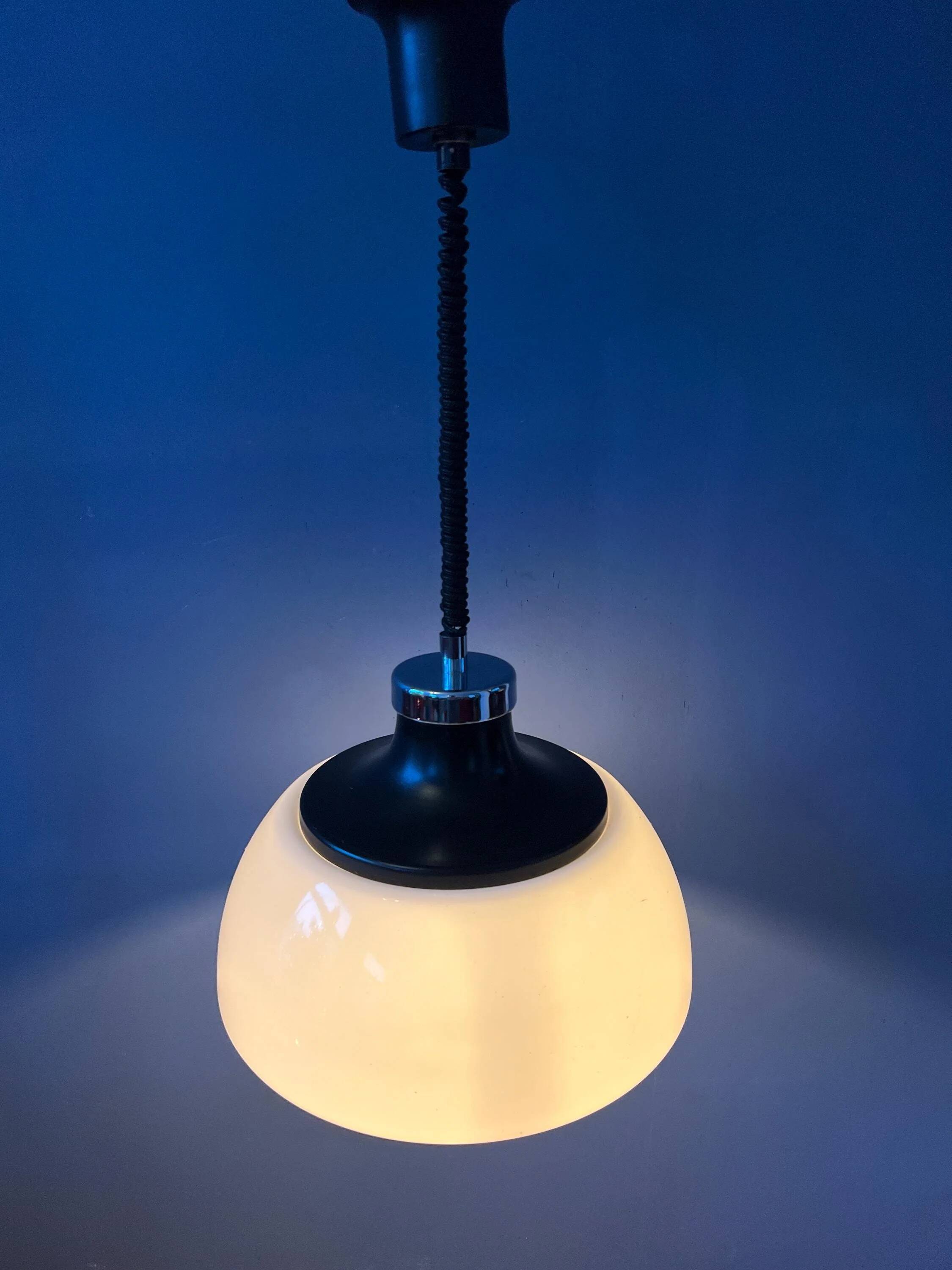 Massive Space Age Mid-Century suspension in plexiglass with white acrylic shade.