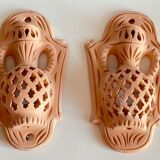 Pair of terracotta wall candle holders