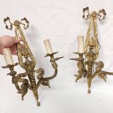 Pair of antique bronze wall lights. Louis style candlestick lamps.