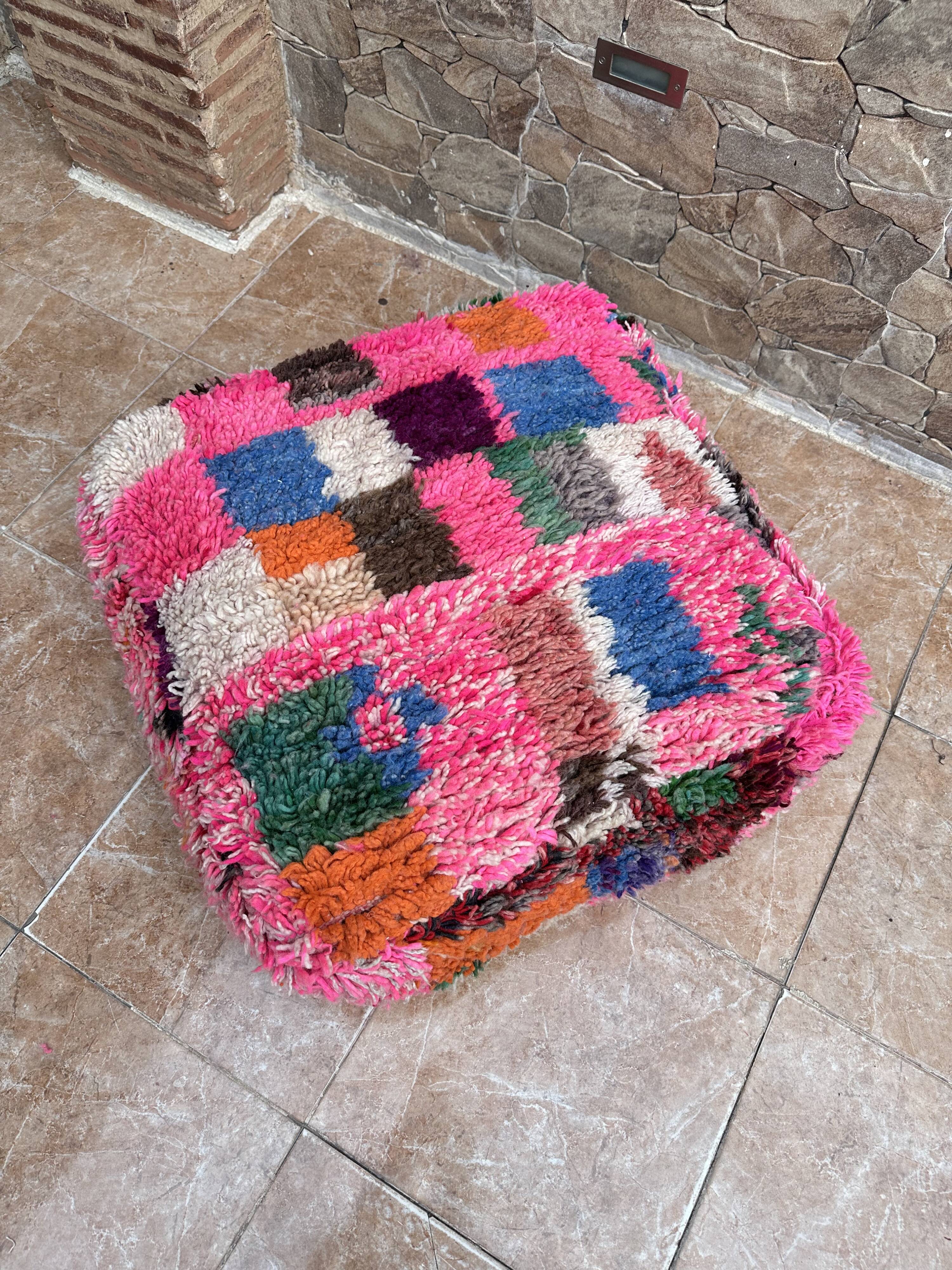 Berber floor pouf: Handwoven Moroccan wool cushion.