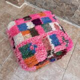 Berber floor pouf: Handwoven Moroccan wool cushion.