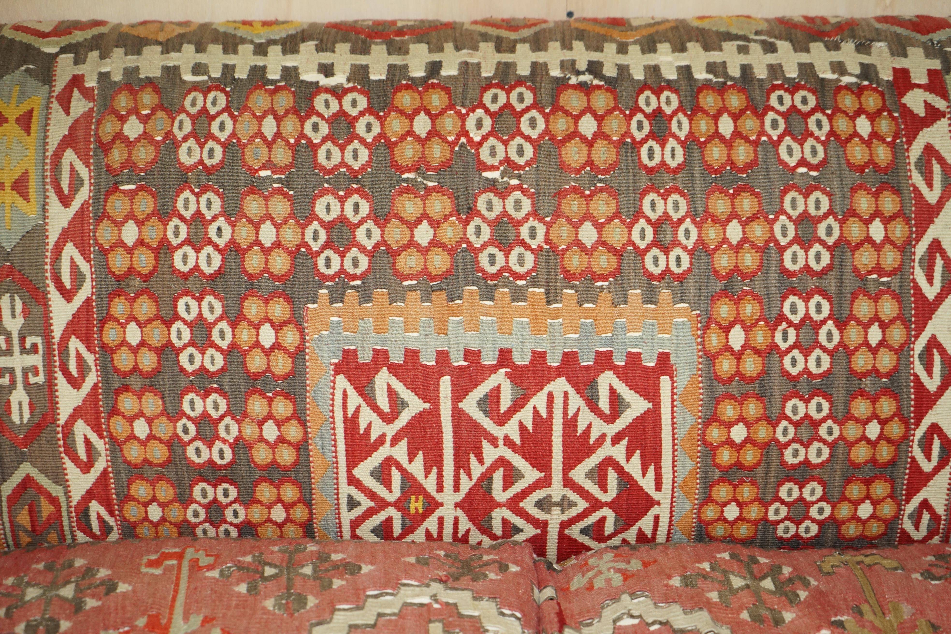 Vintage three-seater canapé by George Smith upholstered in Kilim with feather cushions.