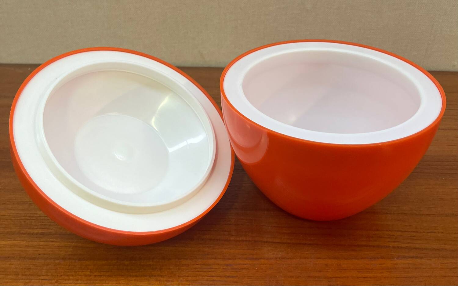 Orange plastic ice cube bucket from the 80s