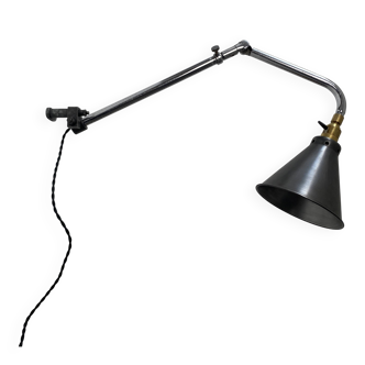 Old industrial wall light that is vintage.