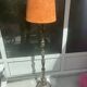 Brass floor lamp with an Orientalist wooden base.