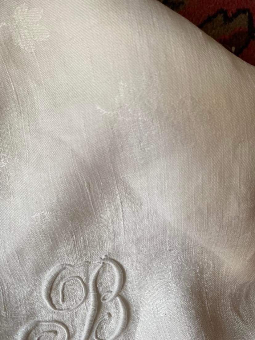 Old tablecloth in white cotton and monogram