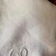 Old tablecloth in white cotton and monogram
