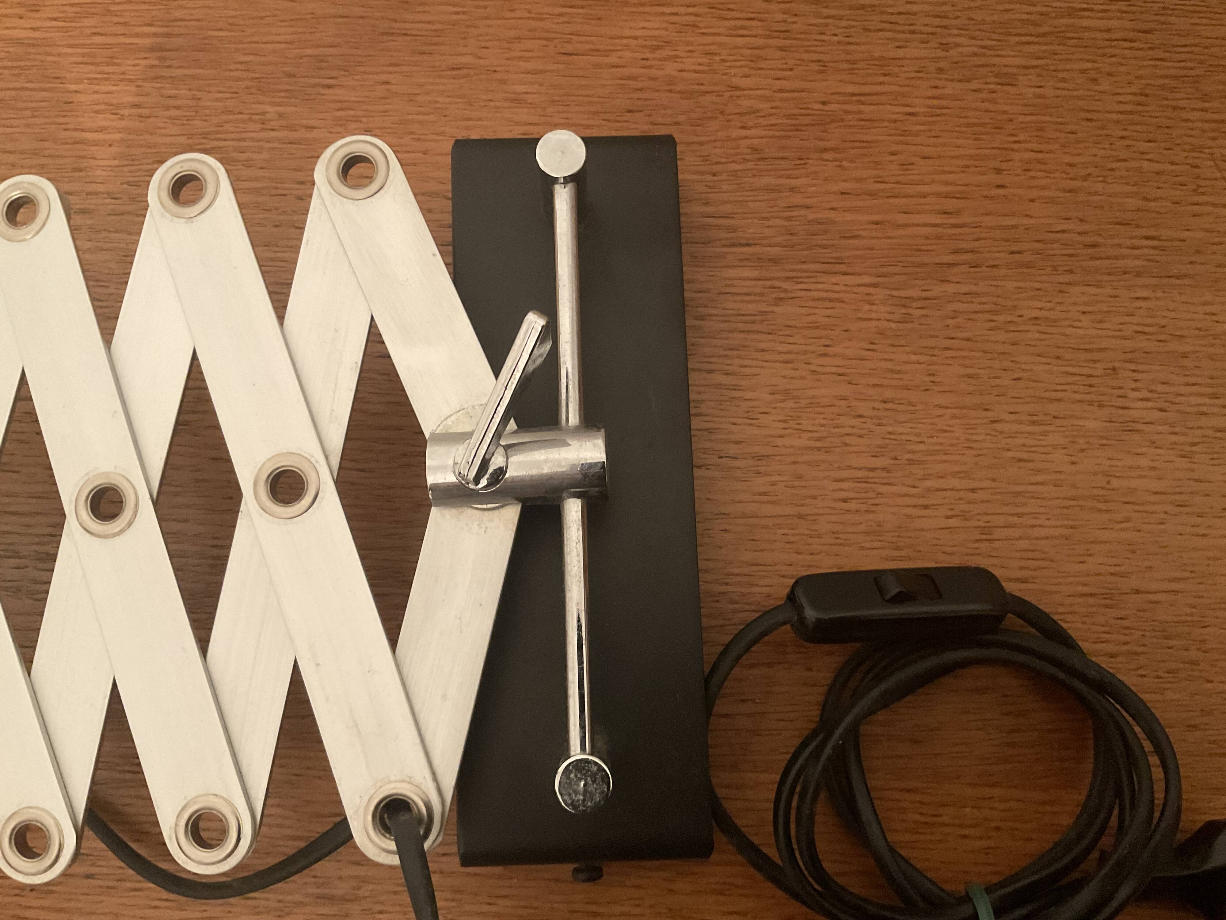 Industrial accordion wall light