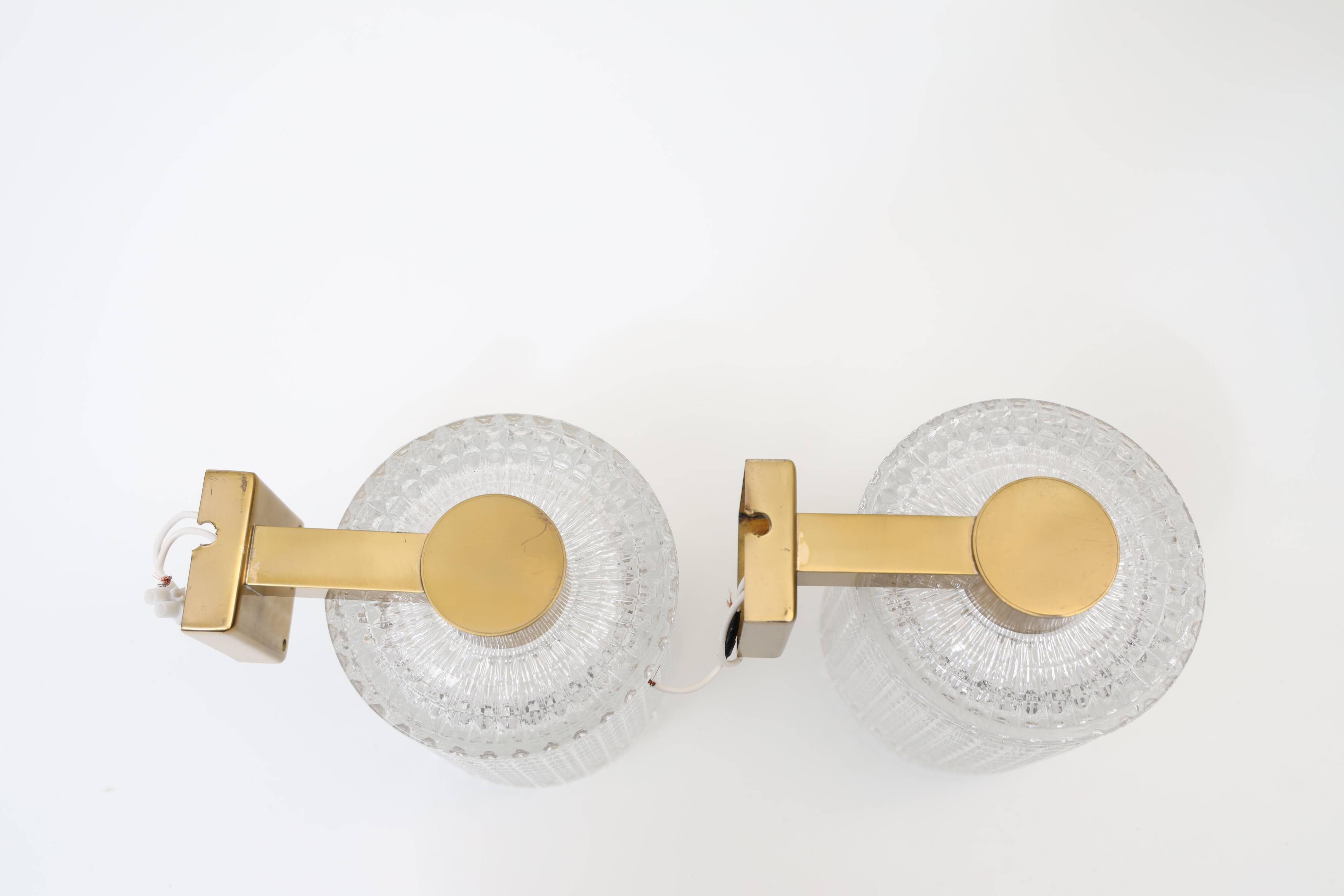 Carl Fagerlund for Orrefors Pair of wall lights in brass and glass Sweden 1960