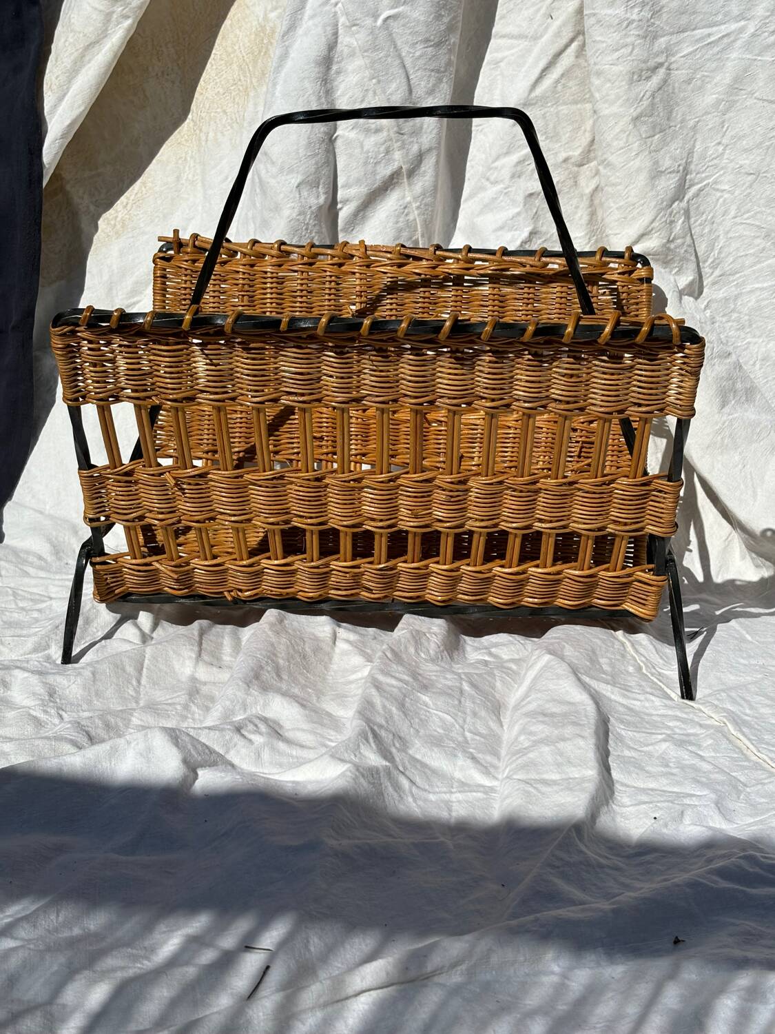 Vintage metal and wicker magazine rack