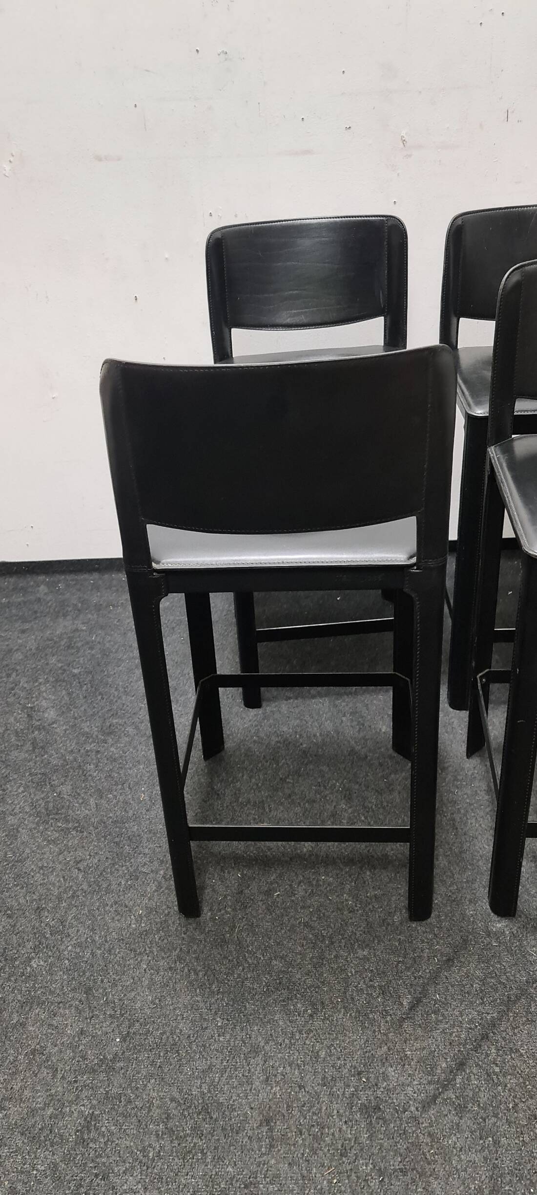 A set of four Italian leather bar stools by Matteo Grassi