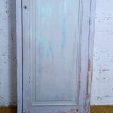 Rustic antique bonnetière in weathered blue-grey wood.