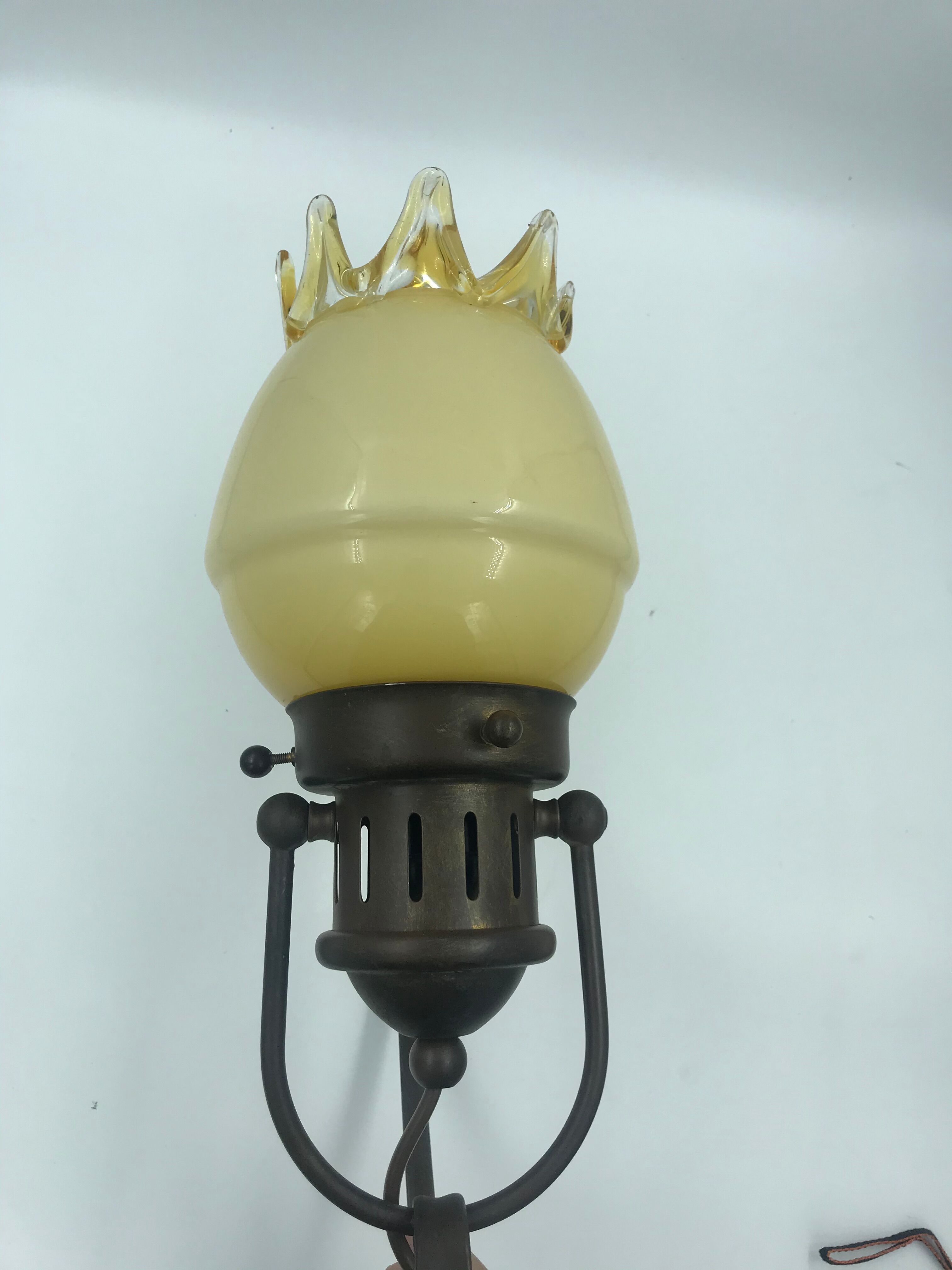 Decorative glass and metal wall light
