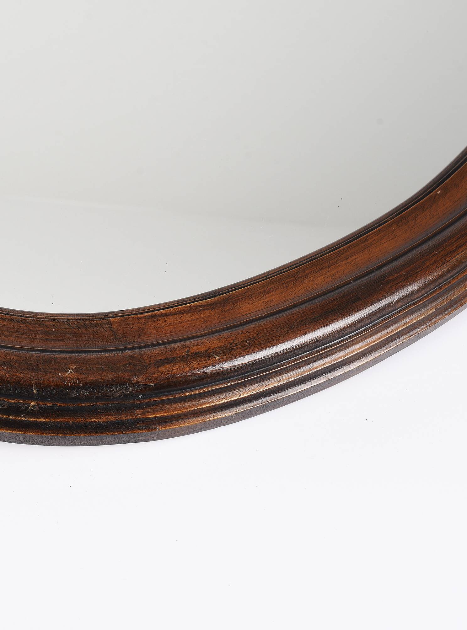 Large old oval wooden mirror