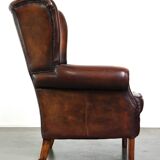 Luxurious sheepskin armchair with a fixed seat cushion and high seating comfort