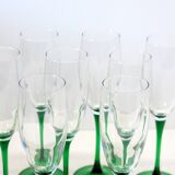 8 large green stem champagne flutes in very good condition.