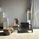 Small low armchair in varnished brown wood