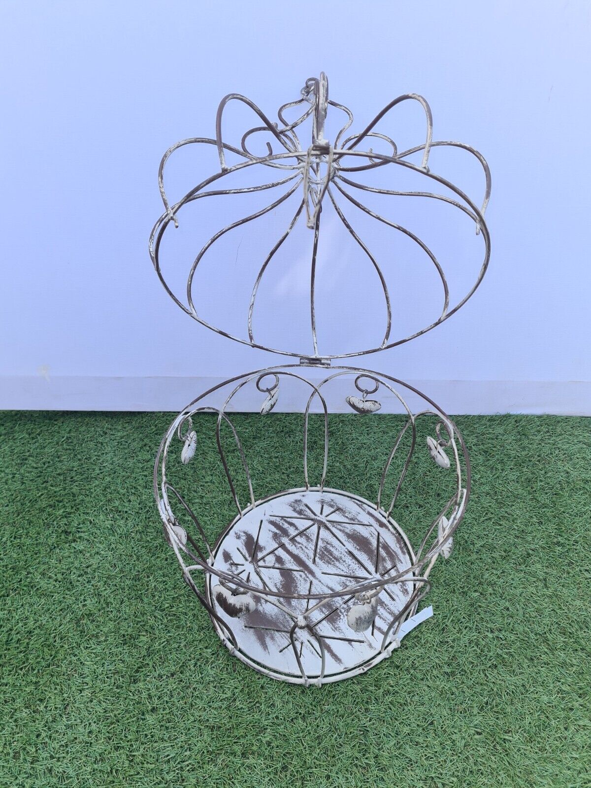 Decorative bird cage with iron hearts