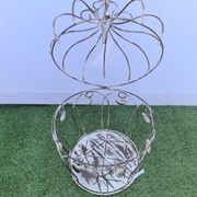 Decorative bird cage with iron hearts