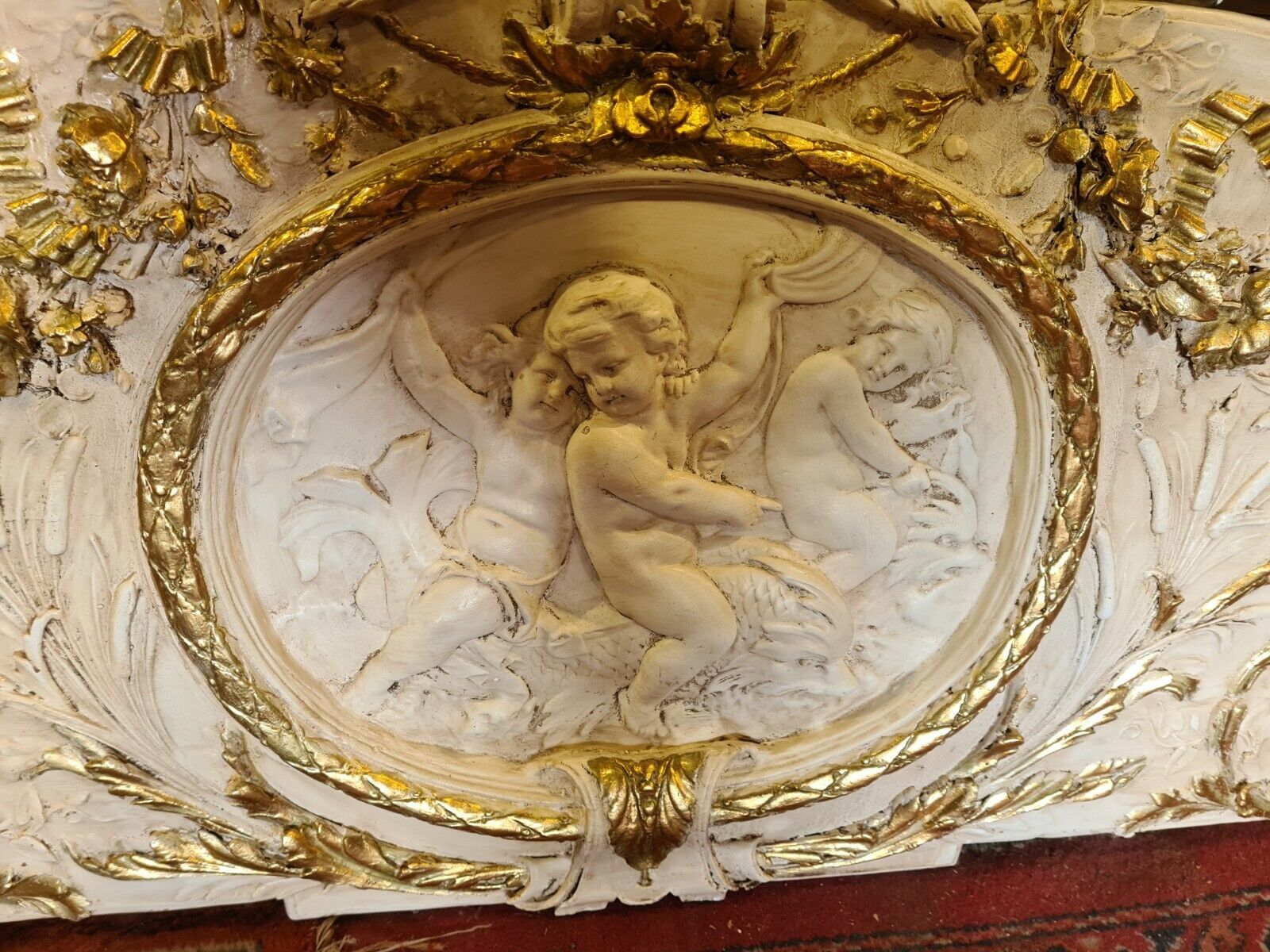 pediment panel with stucco angels
