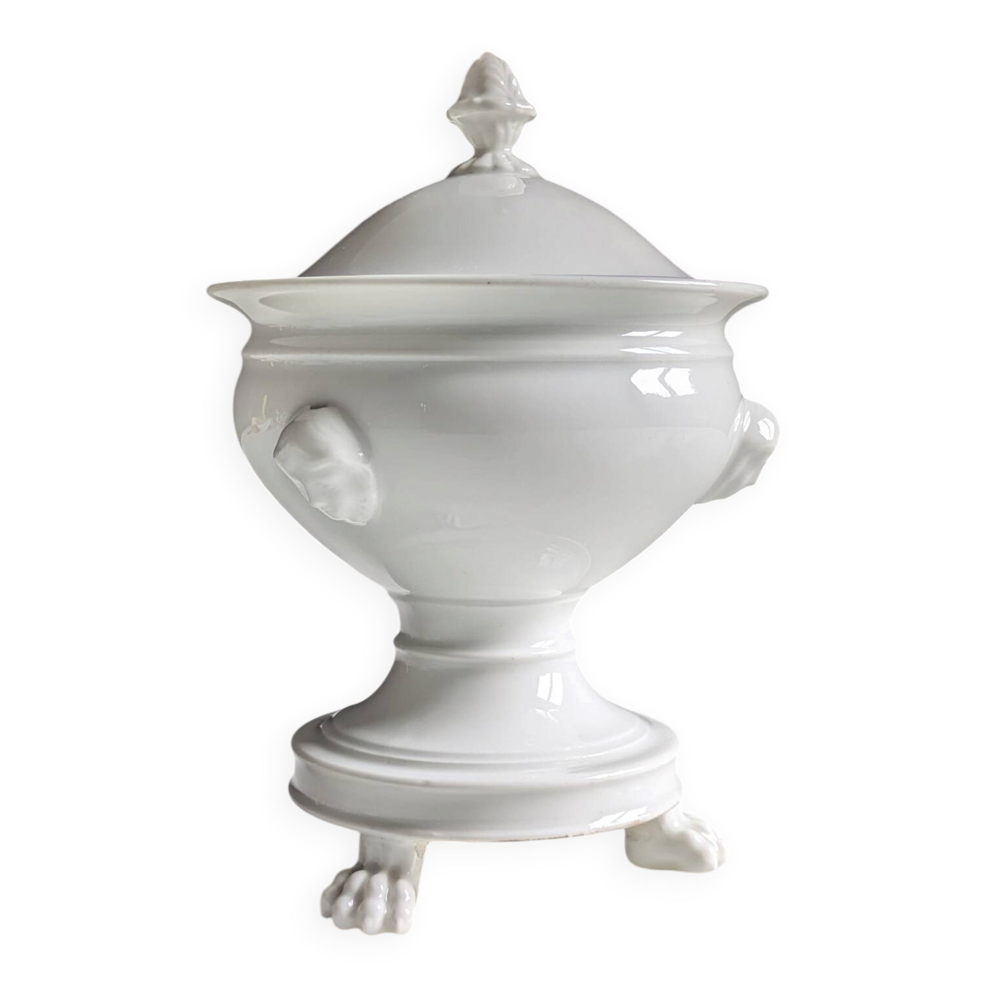 White porcelain confiturier with lion paws and masks. 19th century.