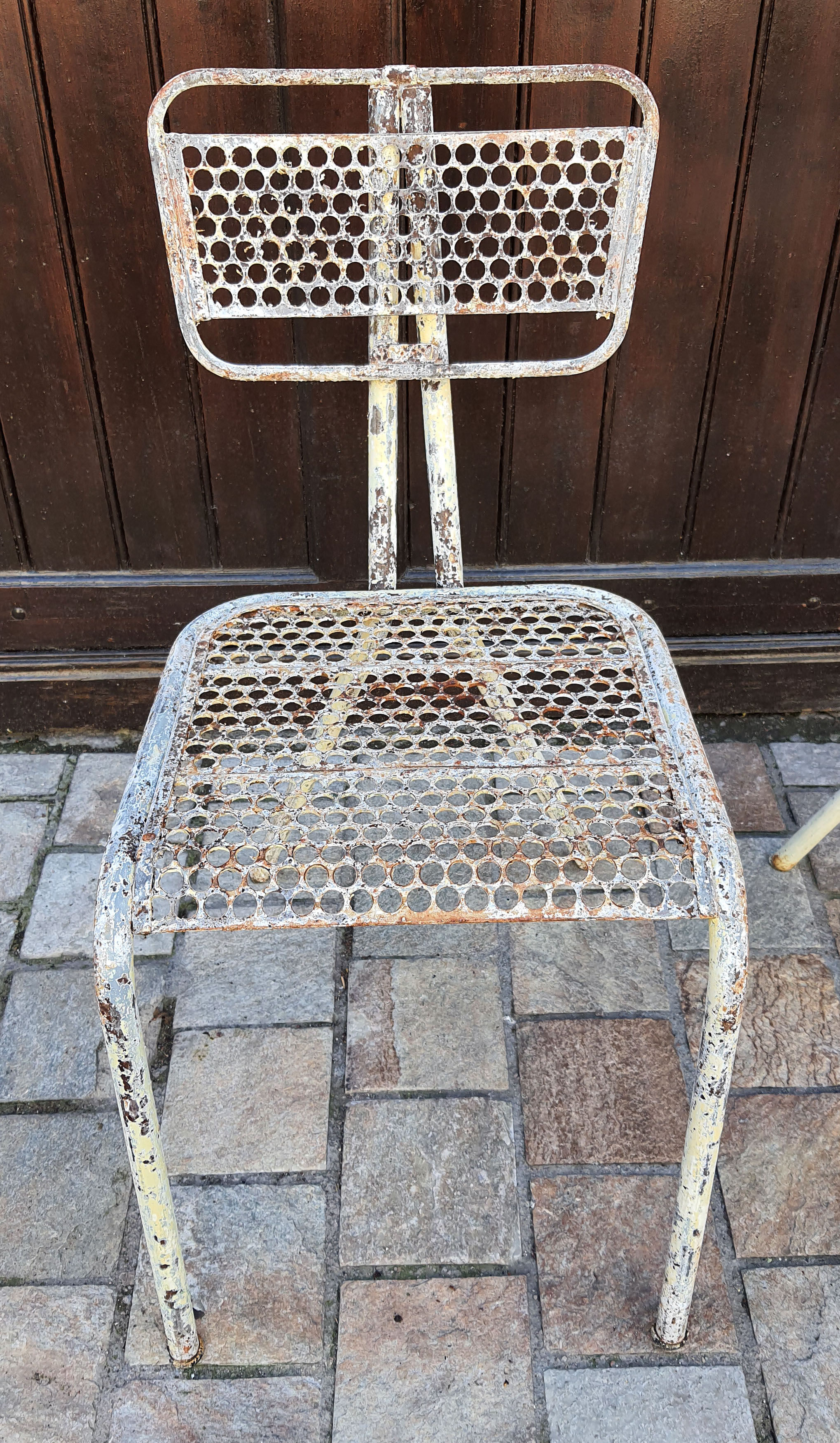 Perforated metal chairs René Malaval 1950