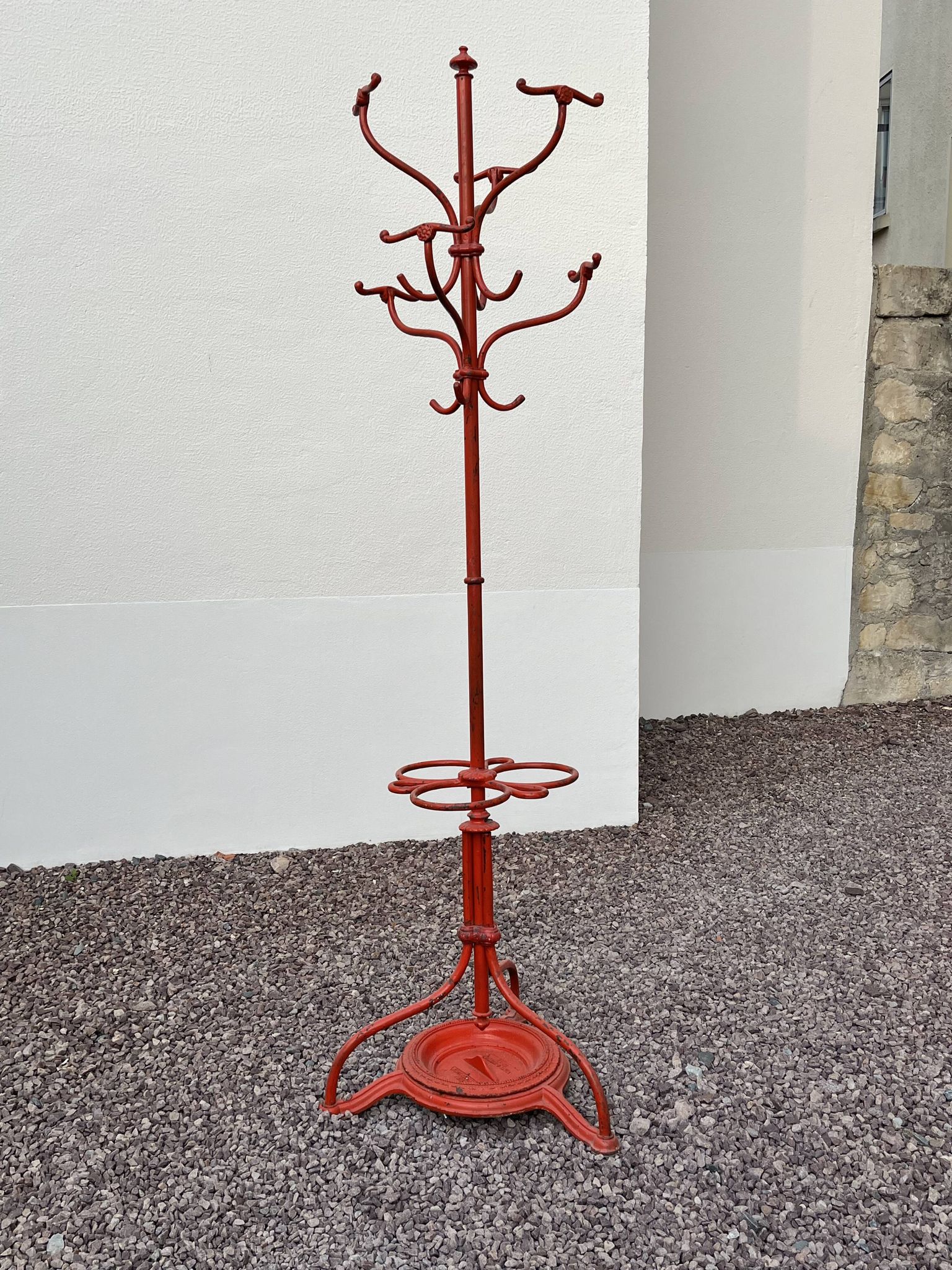 A freestanding coat rack by Hynek Gottwald