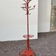 A freestanding coat rack by Hynek Gottwald
