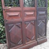 Porte d’entrée vitrée en chêne et grilles en fer, XIXème s.
