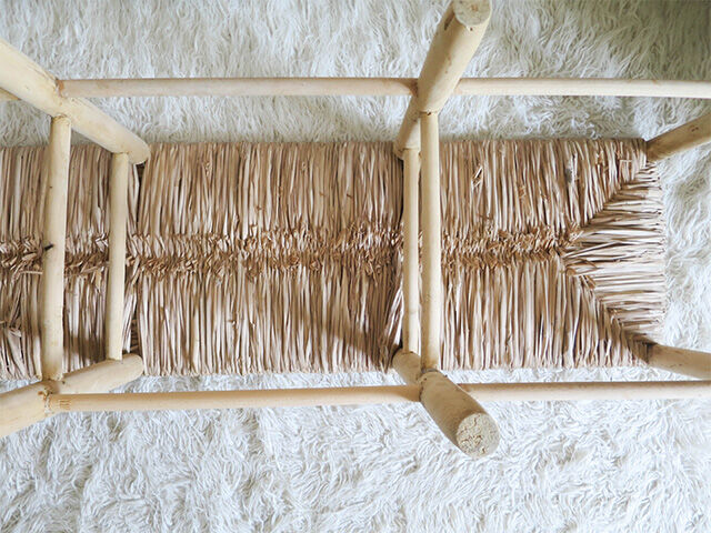 Wooden bench and straw