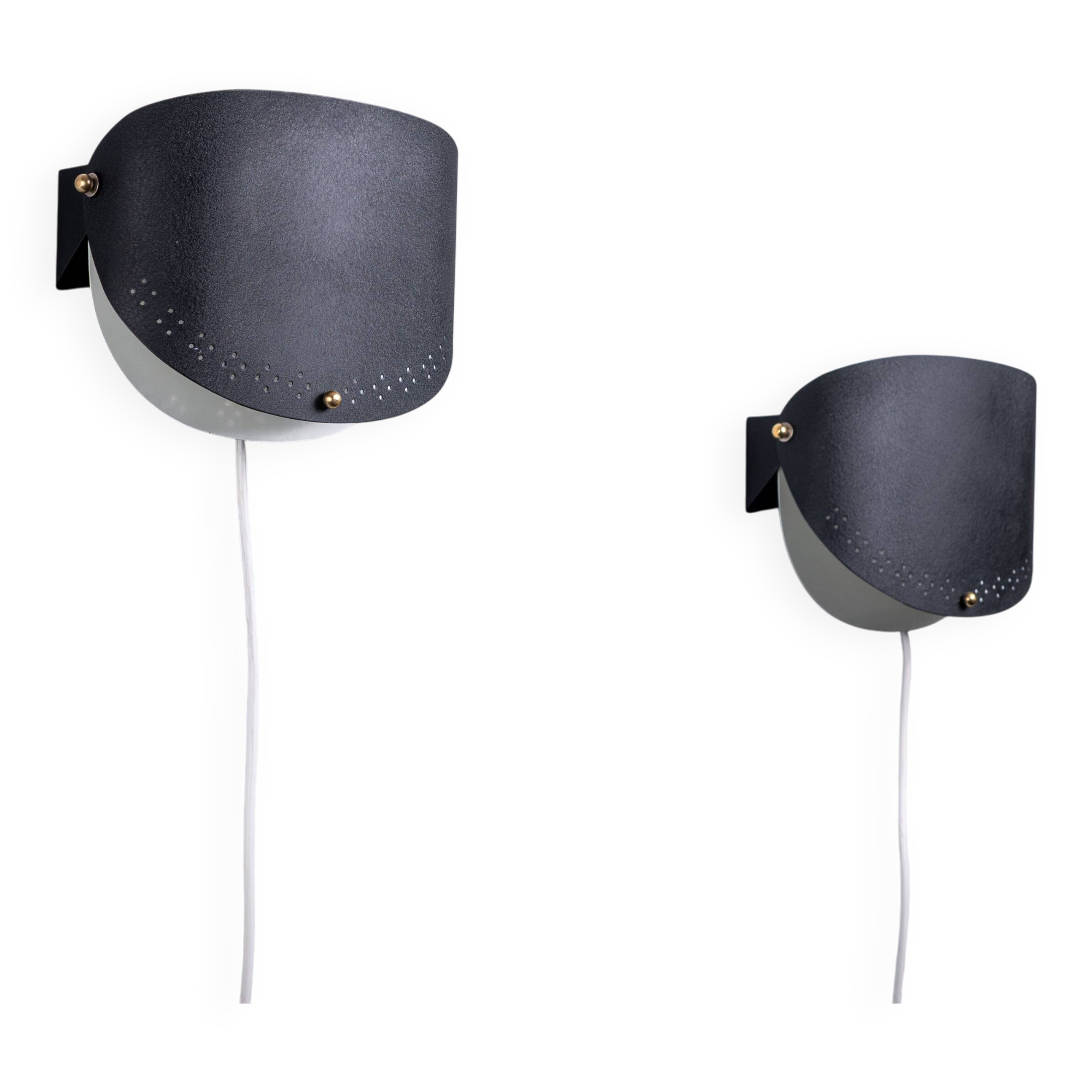 Matte black wall lamps with perforated shades and brass details