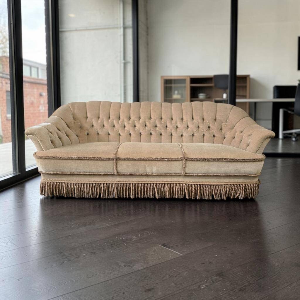 Canapé vintage beige avec franges