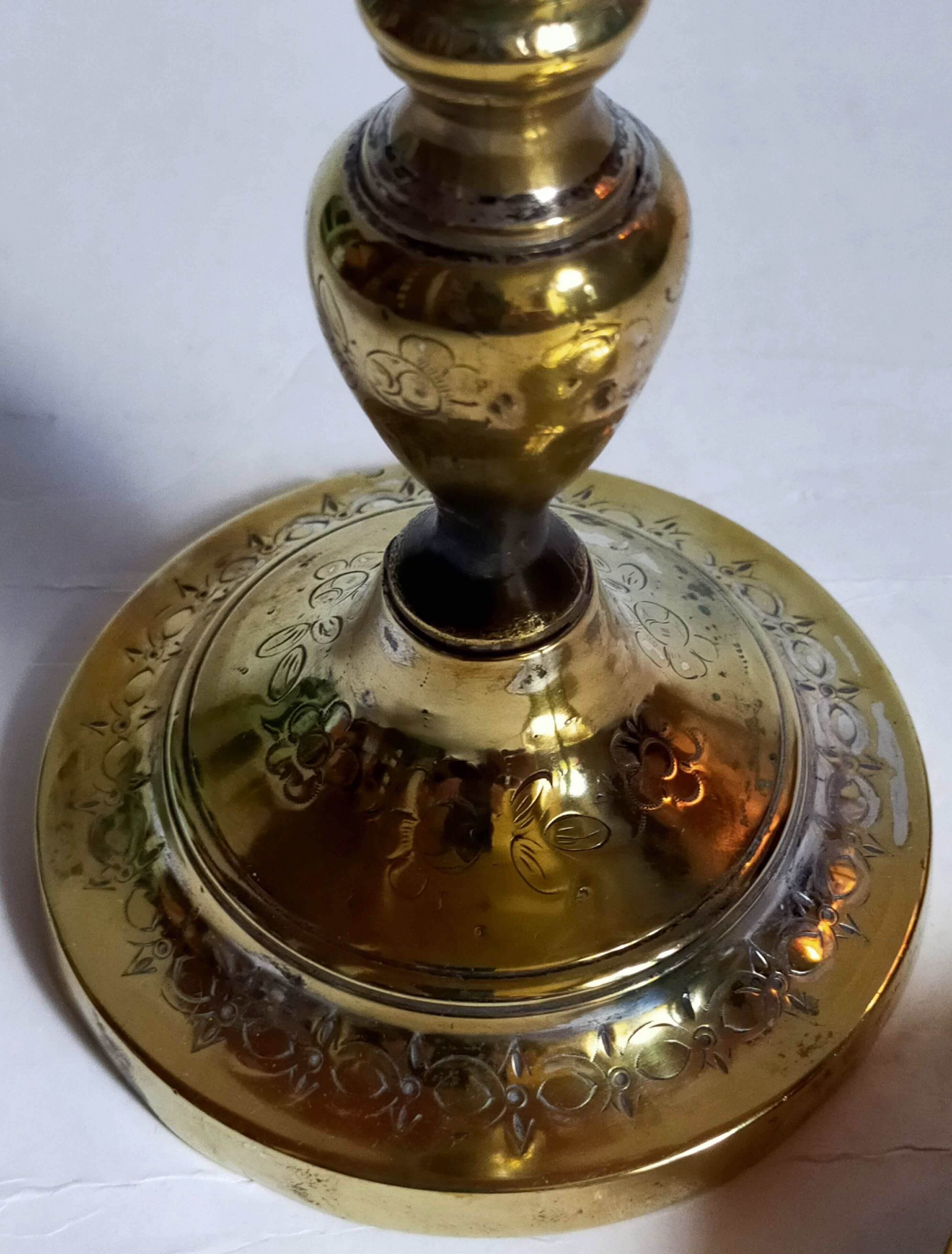Duo of solid brass and gold metal candle holders worked old