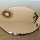 Round beveled amber pink mirror