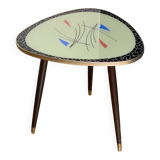 Triangular coffee table with vintage glass top