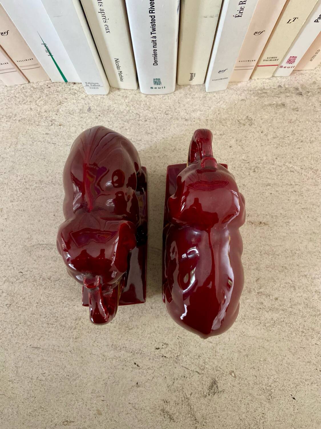 Pair of burgundy ceramic “Elephants” bookends