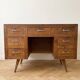 Vintage Scandinavian desk in waxed wood with 7 drawers.