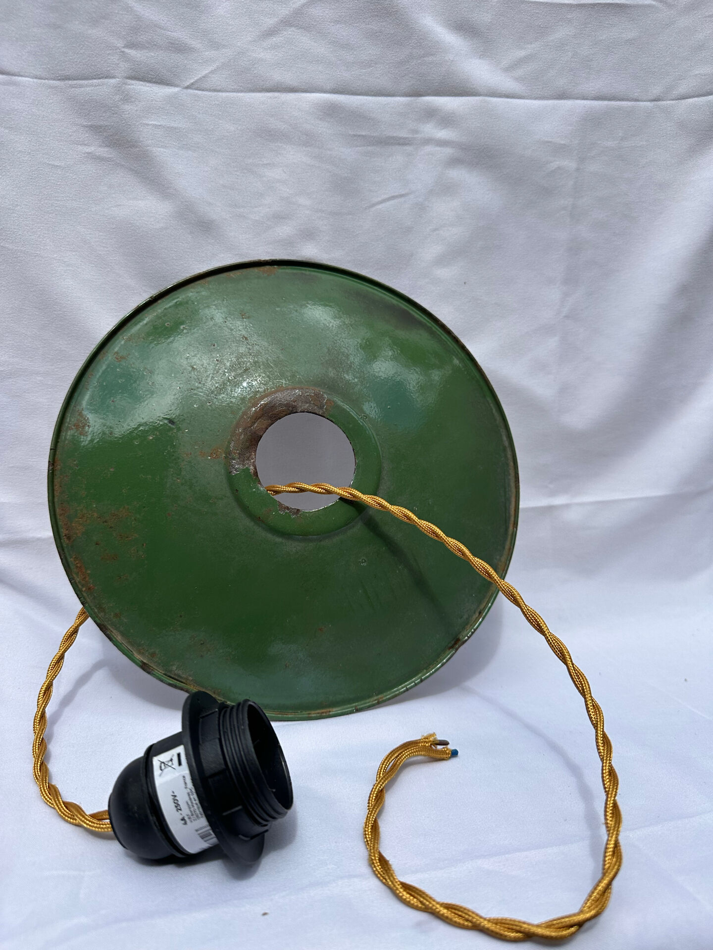 Old green and white enamelled sheet metal suspension