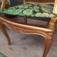 Louis XV-style golden armchair pair