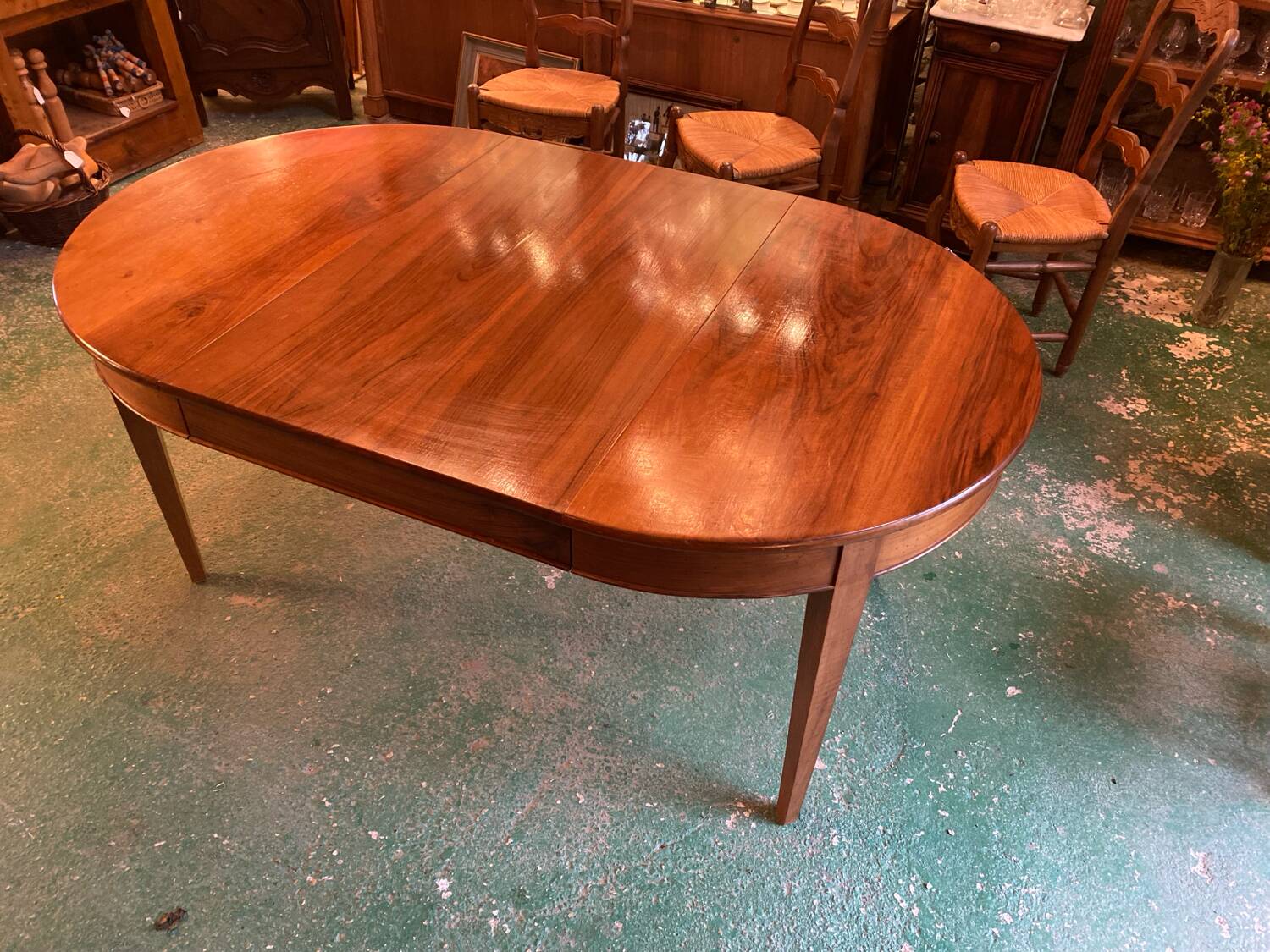 Louis XVI style oval walnut extendable table