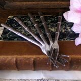 Five silver-plated metal appetizer forks with bamboo-style handles