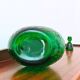 Italian carafe Empoli in iridescent green with diamond pattern.