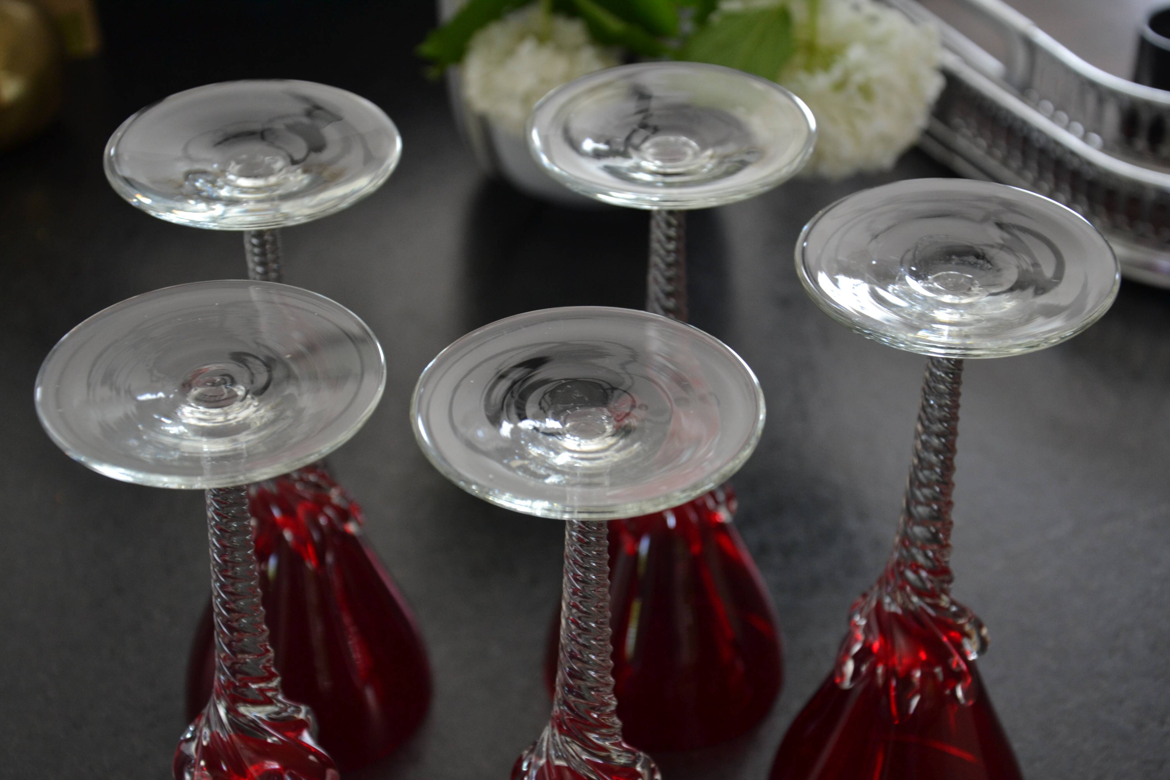 5 red crystal glasses with twisted stems