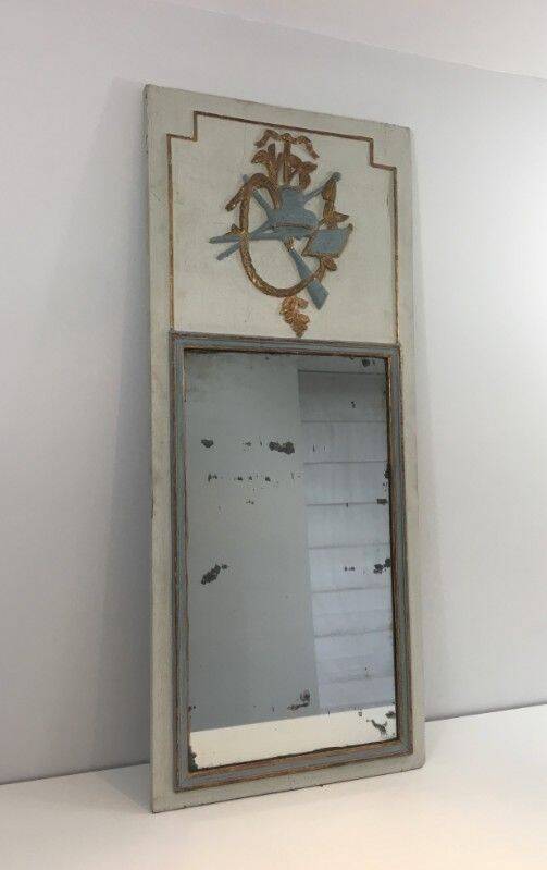 Louis XVI style mirror in patinated carved wood