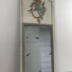 Louis XVI style mirror in patinated carved wood