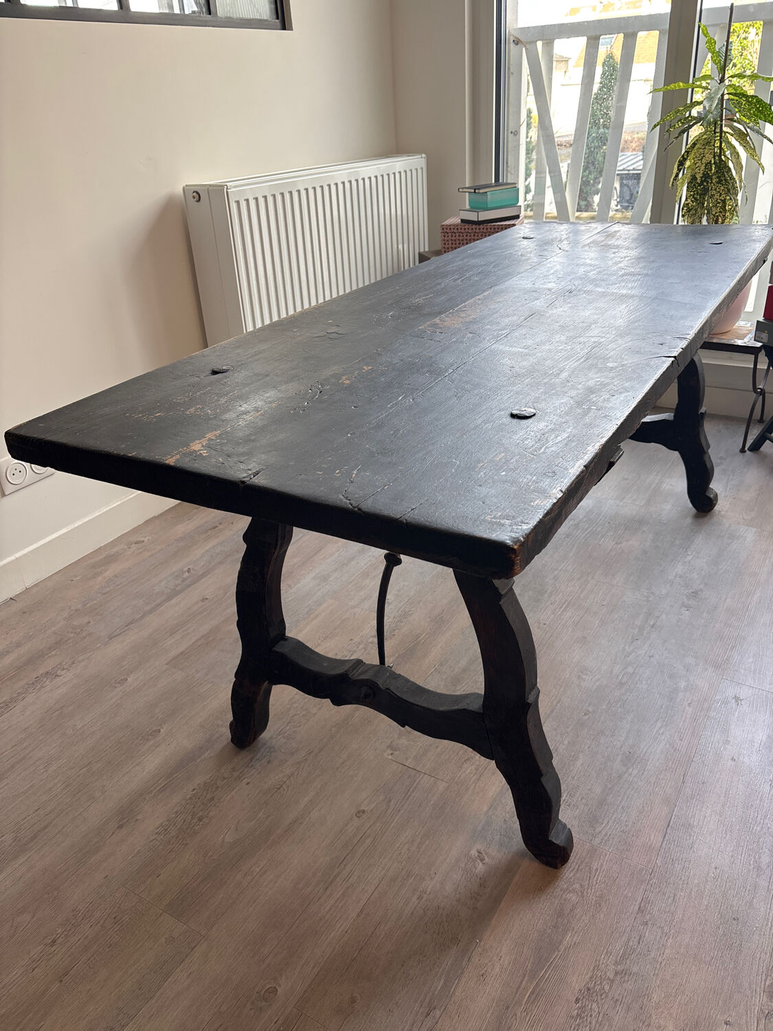 Solid wood farmhouse table with ebony finish.
