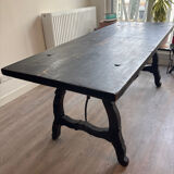 Solid wood farmhouse table with ebony finish.
